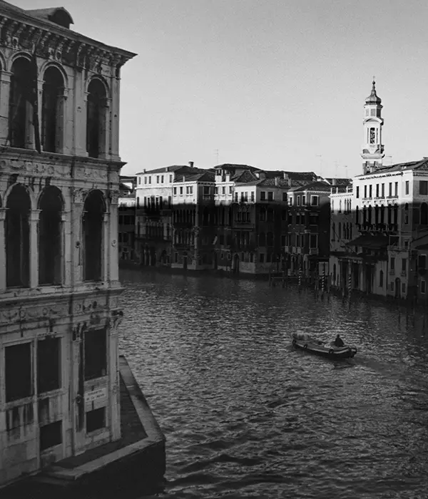A lone boatman tavels down the Grand Canal.